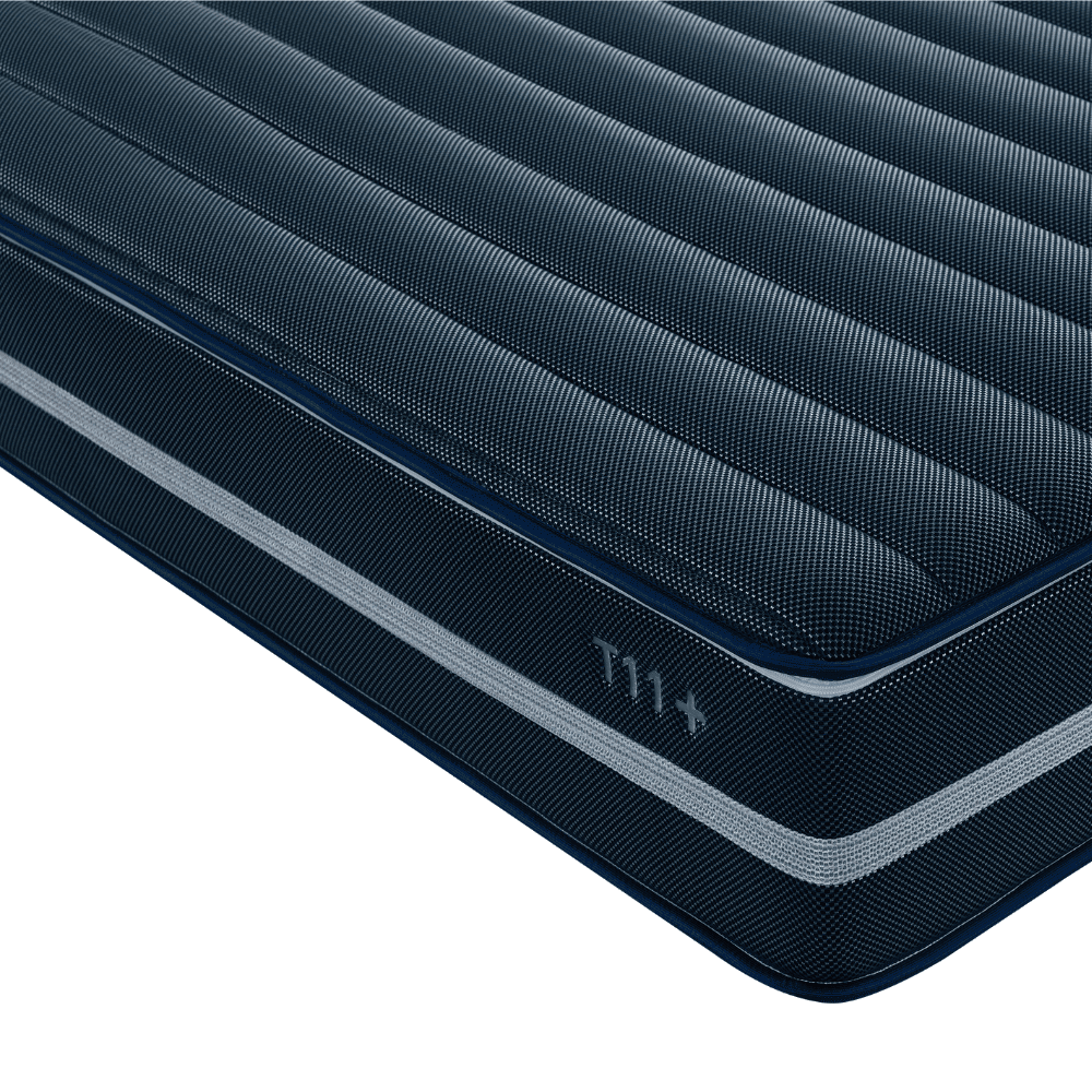 DeRUCCI T11+ AI Smart Mattress corner-facing studio shot, featuring dual-zone independent adjustments and a 5-zone active support system for physical recovery and back pain relief.